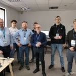 Grupa mężczyzn na wizycie studyjnej w SICK w Warszawie.